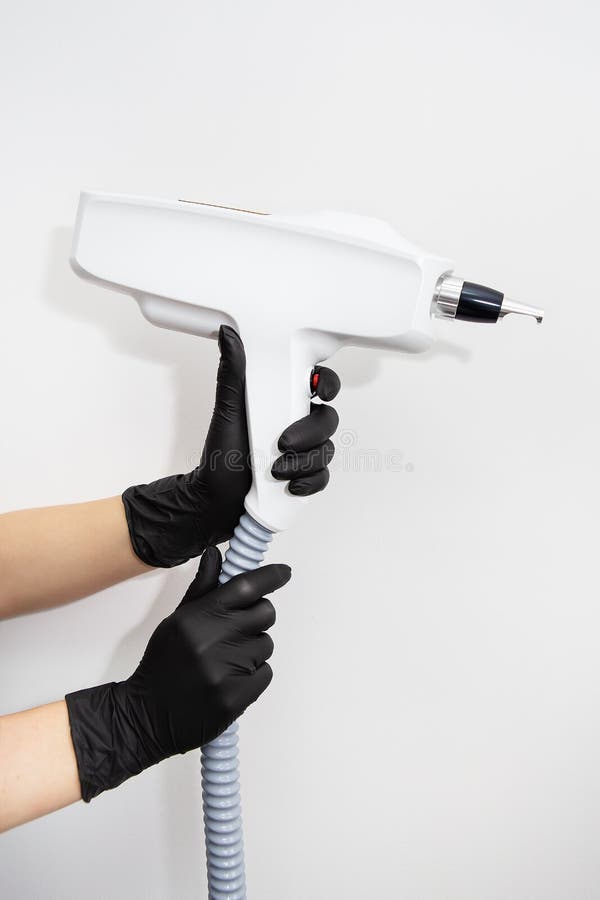 The Master of Laser Hair Removal Holds a Laser Hair Removal Machine in His Hands. Removal of Hair on All Parts of the Body Stock Image - Image of cosmetic, hand: 250439311 The Master of Laser Hair Removal Holds a Laser Hair Removal Machine in His Hands. Removal of Hair on All Parts of the Body Stock Image - Image of cosmetic, hand: 250439311