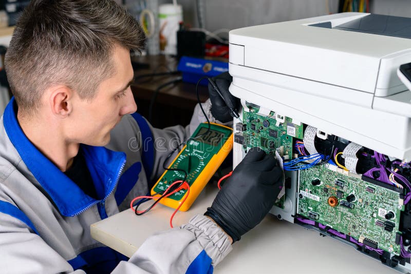 Master is Looking for Damage, Repair Office Equipment Using Multimeter