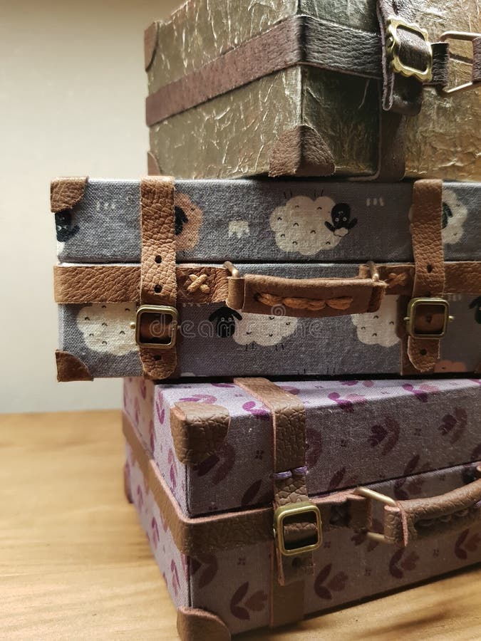 Craftsman makes miniature doll suitcases stock photo