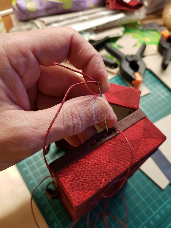 Craftsman makes a miniature doll suitcase royalty free stock photography