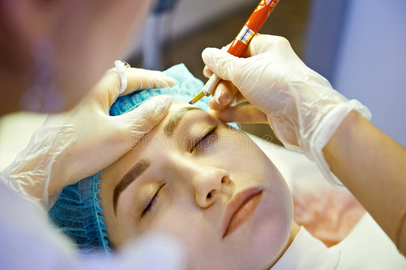 Master making permanent eyebrow make up. Hand, beautiful.