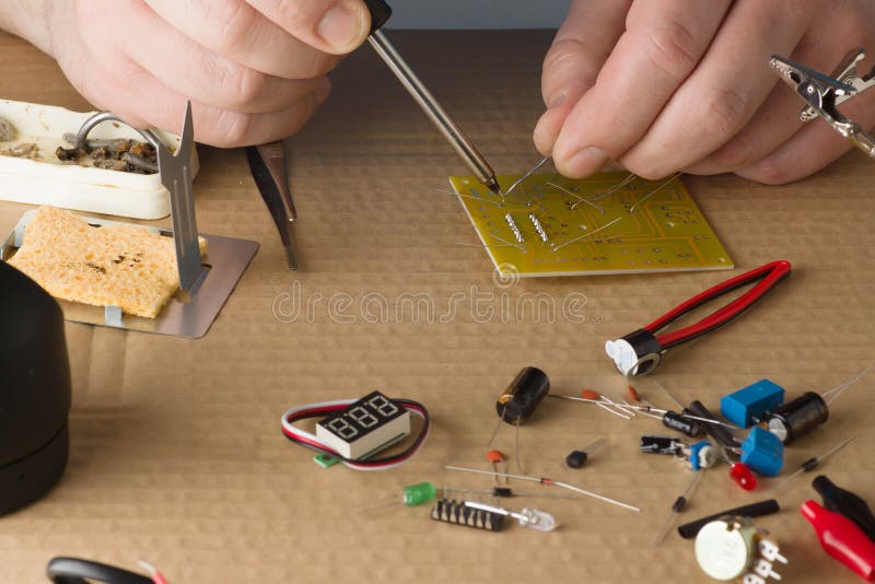 Master in repair shop stock photo. Image of electric 113440094