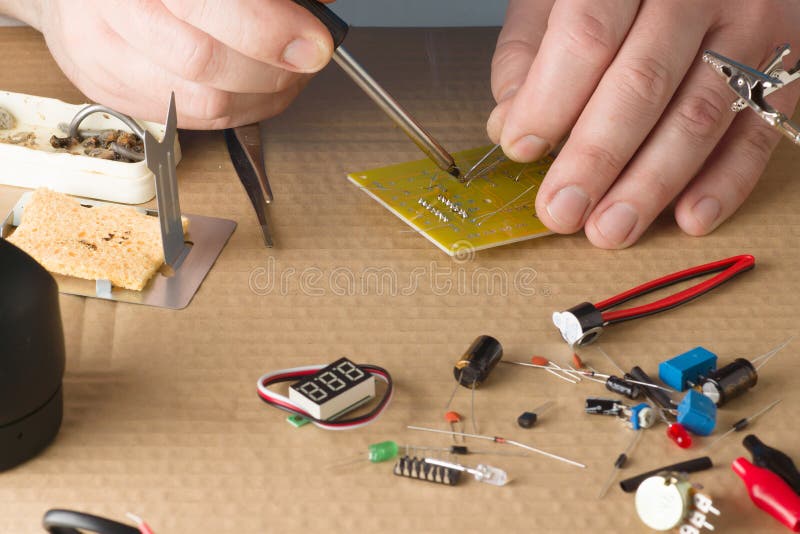 Master in repair shop stock photo