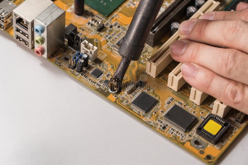 Master repairs chip stock photo. Image of electronic 144463850