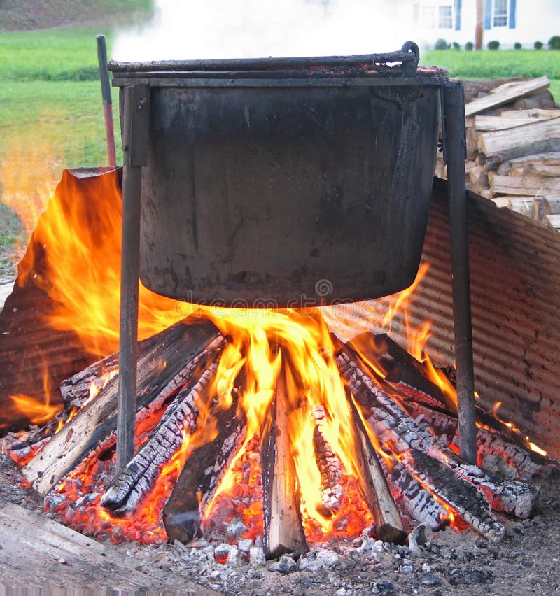 Kettle of apple butter over an open fire. Kettle of apple butter over an open fire