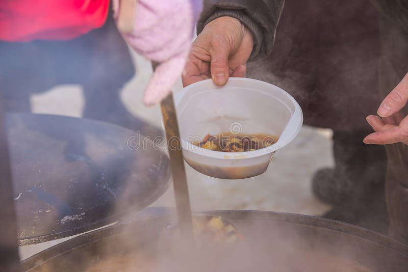 Feeding homeless people on the street, social problems, hungry people eat. Feeding homeless people on the street, social problems, hungry people eat