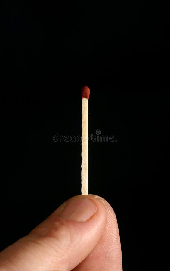 Macro of a man holding a safety match