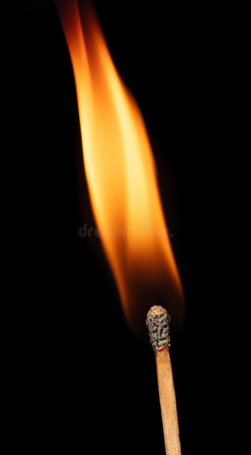 Burning matchsticks against black background, close up stock photo