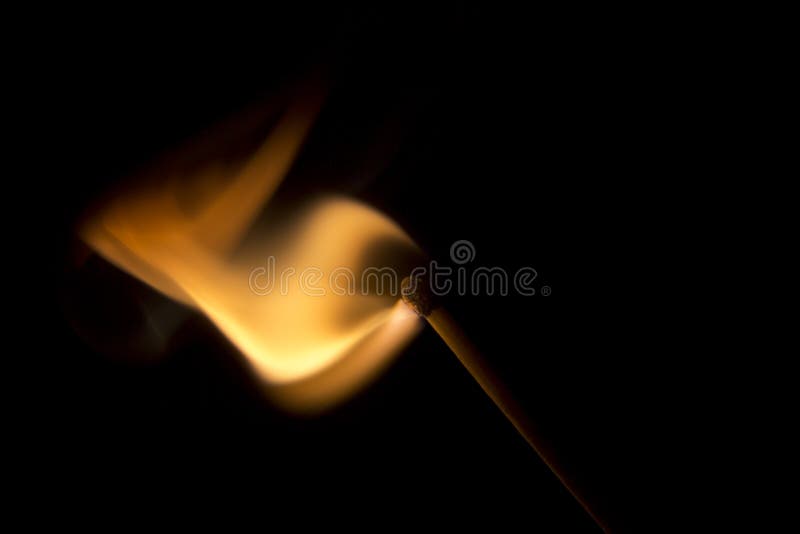 Match Igniting in a burst of fire. Macro Image.