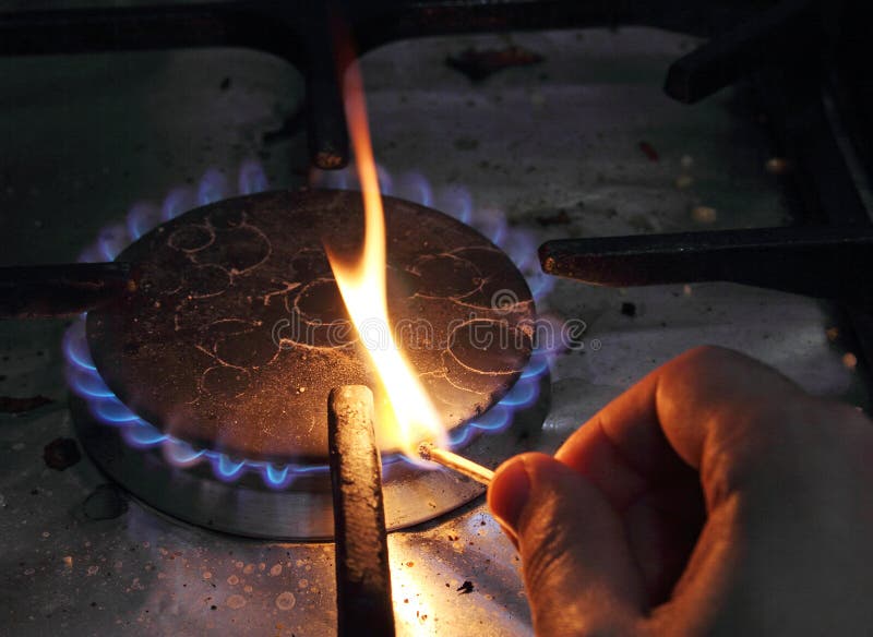 Match lighting stove stock photo. Image of match, heat 68136920