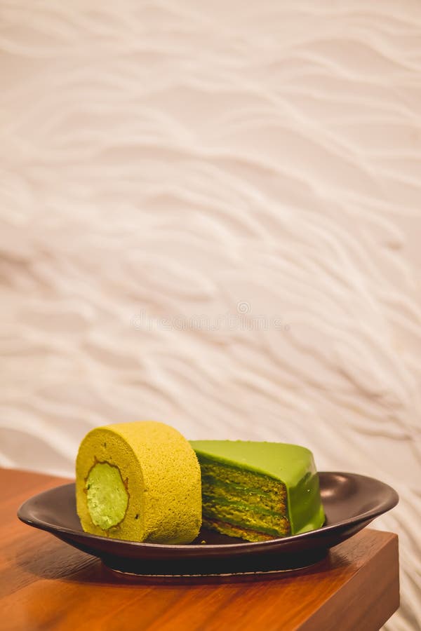 Matcha Green Tea Cake and Green Tea Roll Jam on Plate Stock Photo