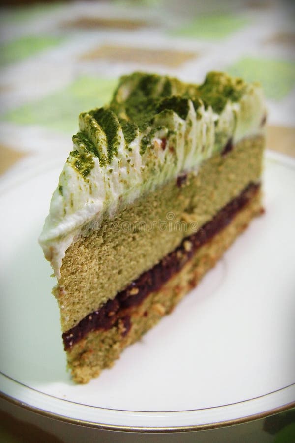 Matcha Green Tea Cake with Whipped Cream and Red Bean Paste Stock Photo