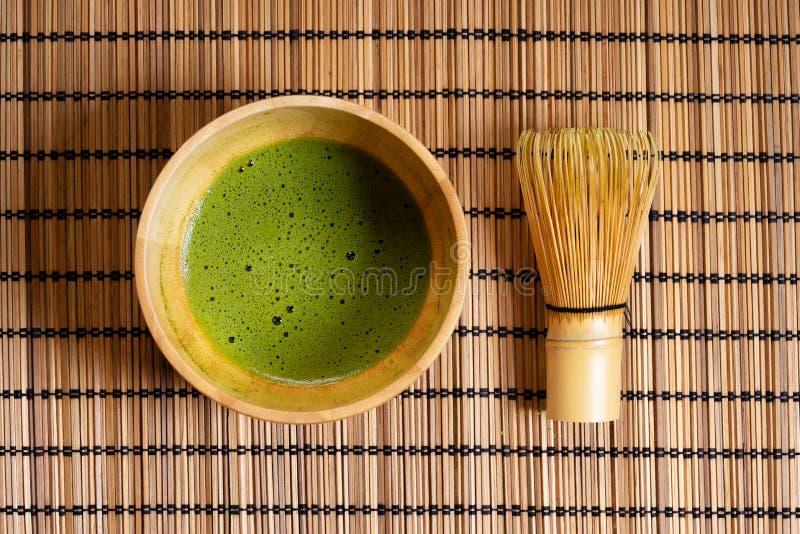 Matcha green tea drink in wooden bowl with bamboo whisk royalty free stock photos Matcha green tea drink in wooden bowl with bamboo whisk royalty free stock photos