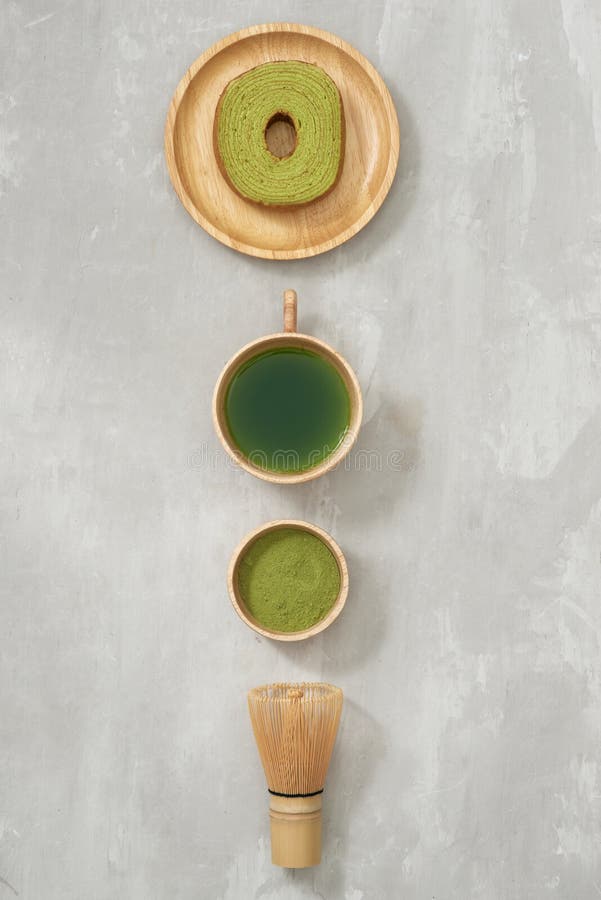 Matcha Green Tea Latte in a Cup and Tea Ceremony Utensils with German