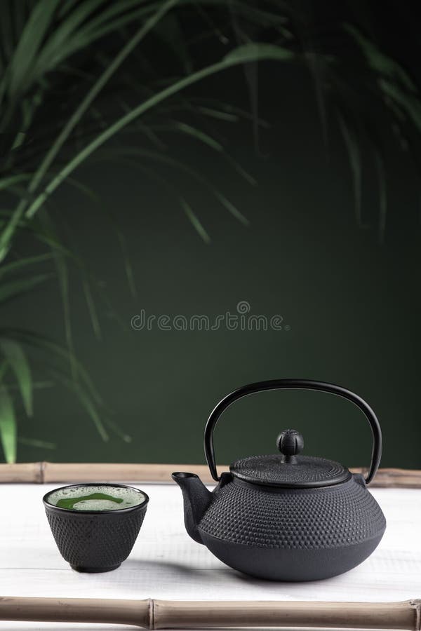Matcha Tea and Teapot on Green Background on White Wooden Base ...