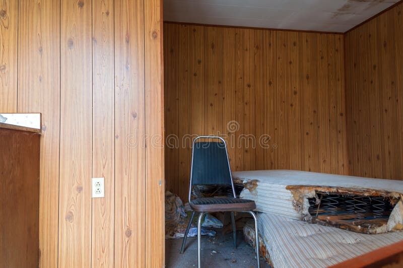 A wrecked mattresses in an abandoned motel room. A wrecked mattresses in an abandoned motel room