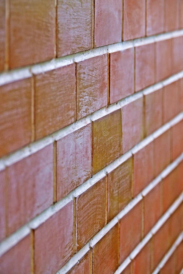 Materiale di base di struttura del muro di mattoni della costruzione di edifici di industria fotografie stock Materiale di base di struttura del muro di mattoni della costruzione di edifici di industria fotografie stock