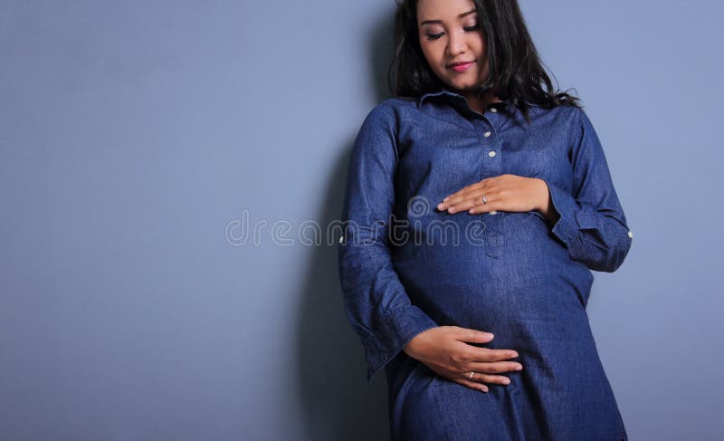 Maternity fashion background concept in blue stock photo Maternity fashion background concept in blue stock photo
