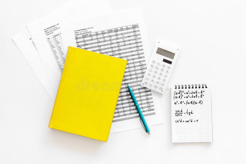 Math homework. Math textbook or tutorial near sheet with numbers, countes, calculator, notebook with formula on white stock photo