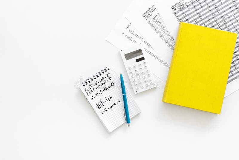 Math homework. Math textbook or tutorial near sheet with numbers, countes, calculator, notebook with formula on white stock photo