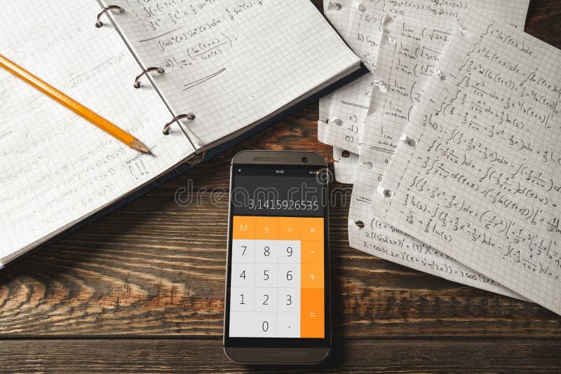 Mathematical equations written in a notebook. Calculator app.