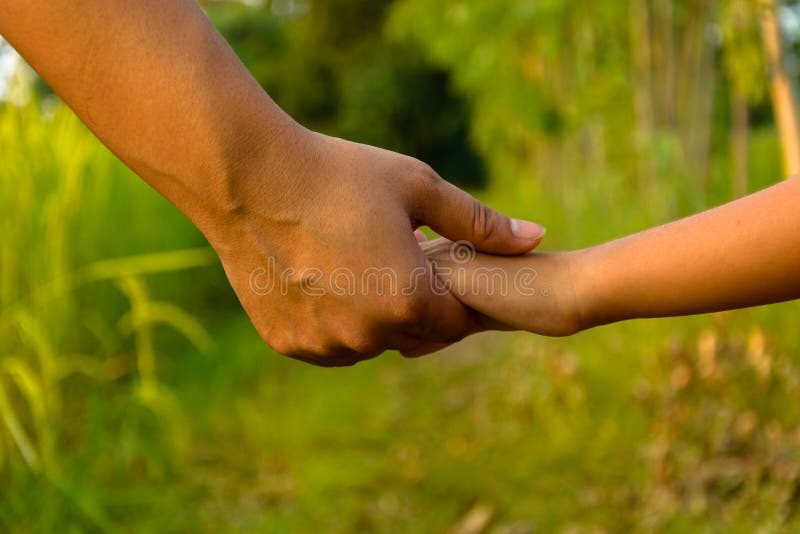 Mather giving hand to a child royalty free stock image Mather giving hand to a child royalty free stock image