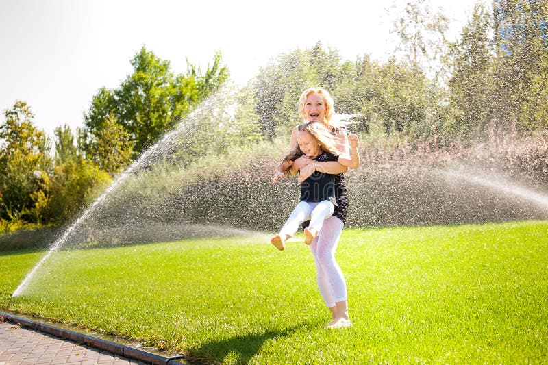 Mather and her daughter in the park. stock photo Mather and her daughter in the park. stock photo