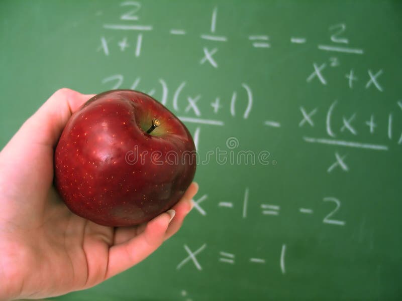 Classroom chalkboard with math, apple in focus. Classroom chalkboard with math, apple in focus.