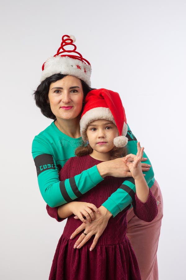 mother and daughter new year studio portrait happy family. mother and daughter new year studio portrait happy family