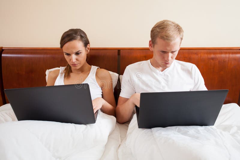 Horizontal view of marriage addicted to internet. Horizontal view of marriage addicted to internet