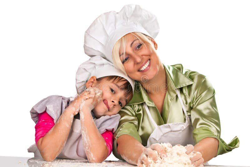 Matriz e filha que preparam a massa de pão fotografia de stock Matriz e filha que preparam a massa de pão fotografia de stock