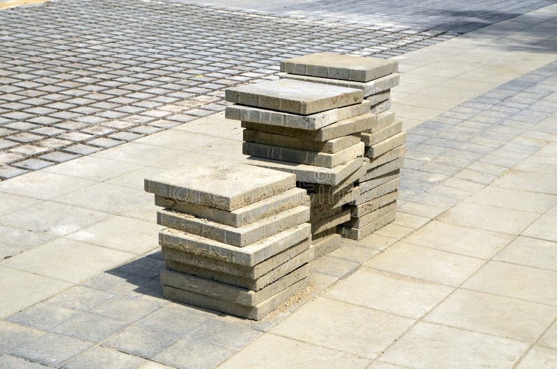 Mattonelle della pavimentazione sul nuovo marciapiede immagine stock Mattonelle della pavimentazione sul nuovo marciapiede immagine stock