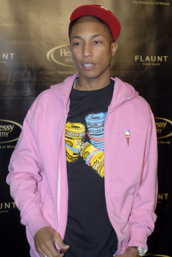 Pharrell Williams appearing on the red carpet. Pharrell Williams appearing on the red carpet.