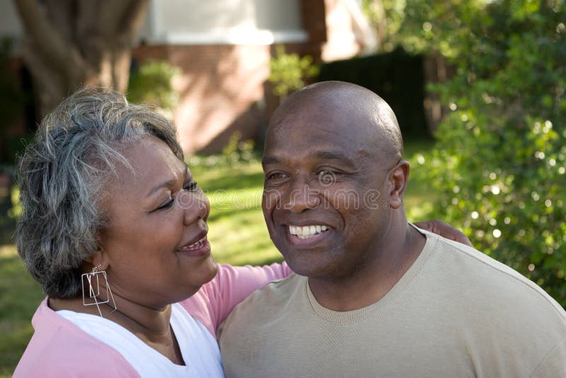 Mature African American couple laughing and hugging. royalty free stock images Mature African American couple laughing and hugging. royalty free stock images