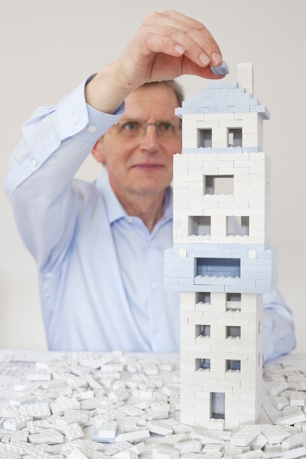 Mature Architect Constructing a House of Toy Blocks Stock Image Image of construct, plan