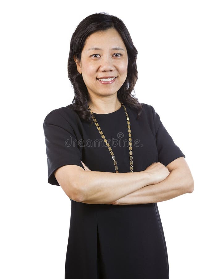 Mature Asian Woman in Business attire standing relaxed stock photo Mature Asian Woman in Business attire standing relaxed stock photo