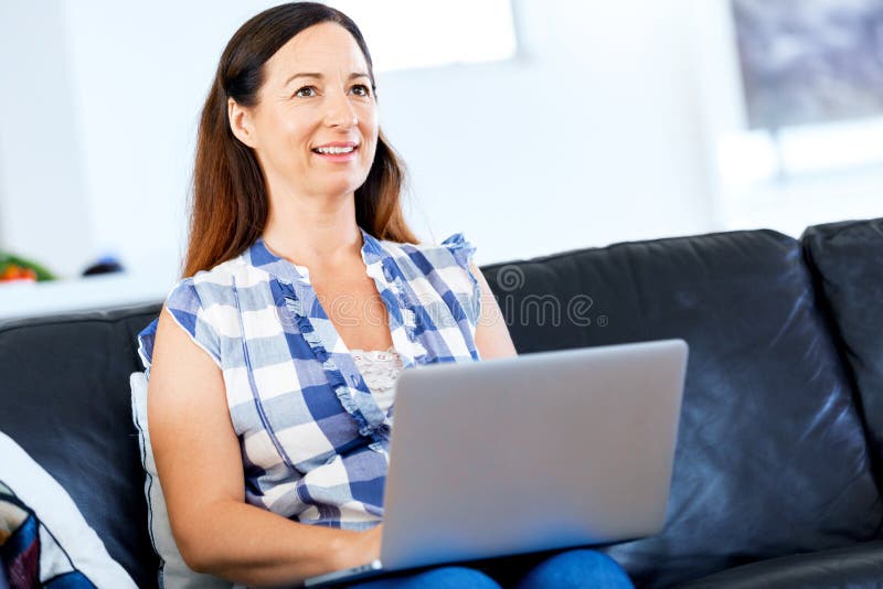 Mature beautiful woman working on her laptop