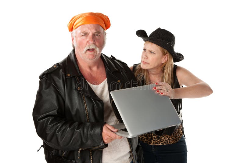 Mature biker couple arguing about a computer