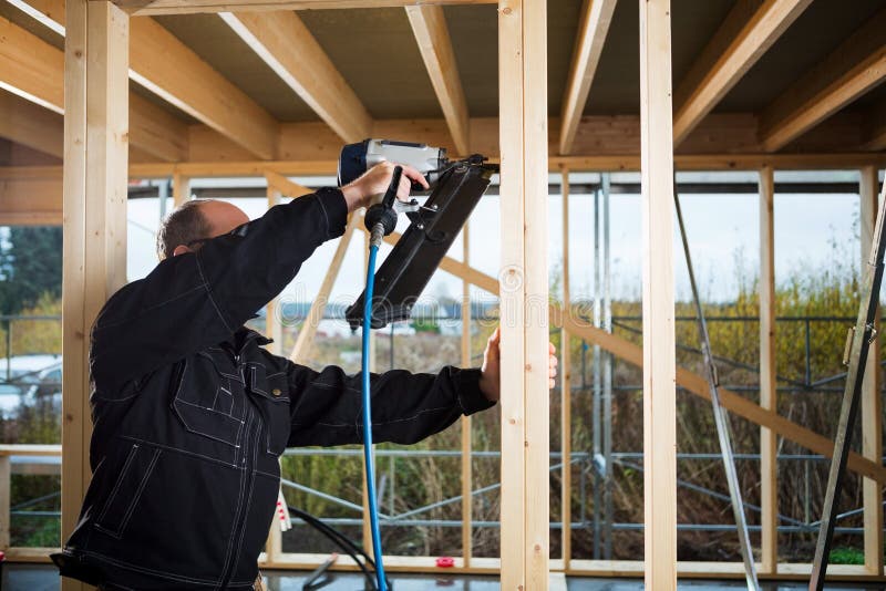 Mature Carpenter Drilling Wood Stock Image - Image of caucasian ...