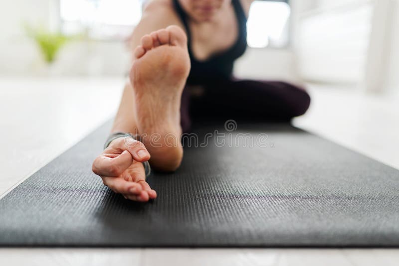Mature Caucasian woman practicing yoga on livingroom floor stock images Mature Caucasian woman practicing yoga on livingroom floor stock images