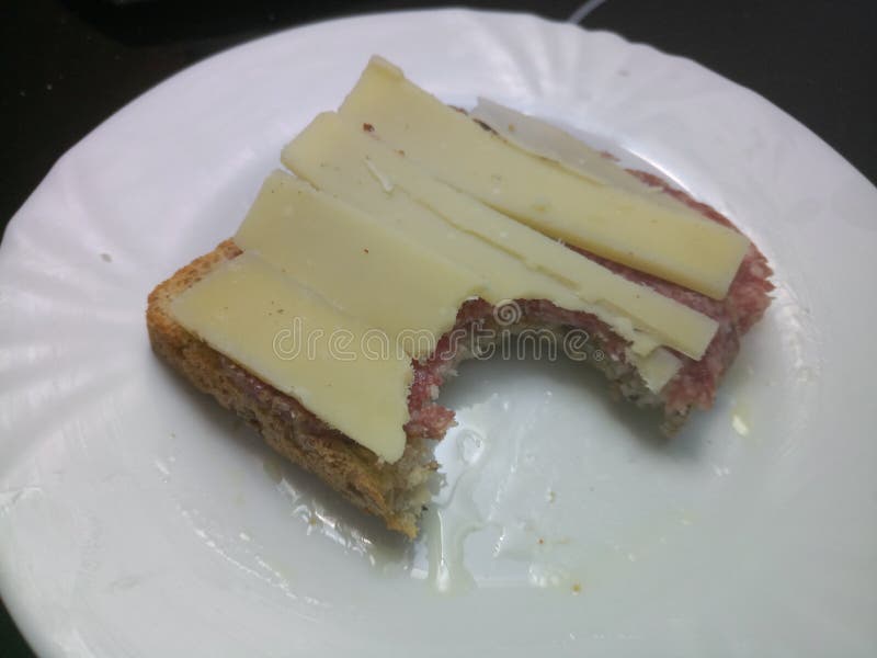 Mature Cheddar Cheese and Chorizo on a Slice of Bread Stock Photo