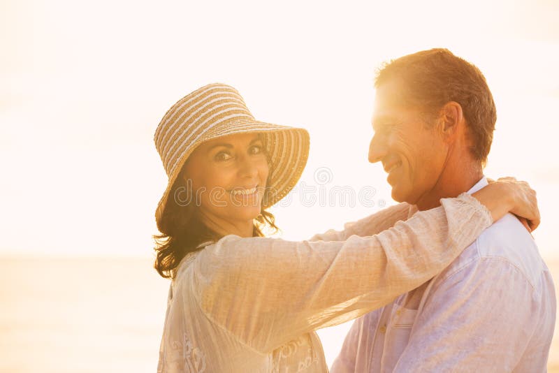 Mature Couple in Love on the Beach at Sunset stock image Mature Couple in Love on the Beach at Sunset stock image