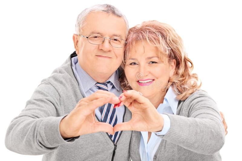 Mature couple making heart with their hands stock photography Mature couple making heart with their hands stock photography