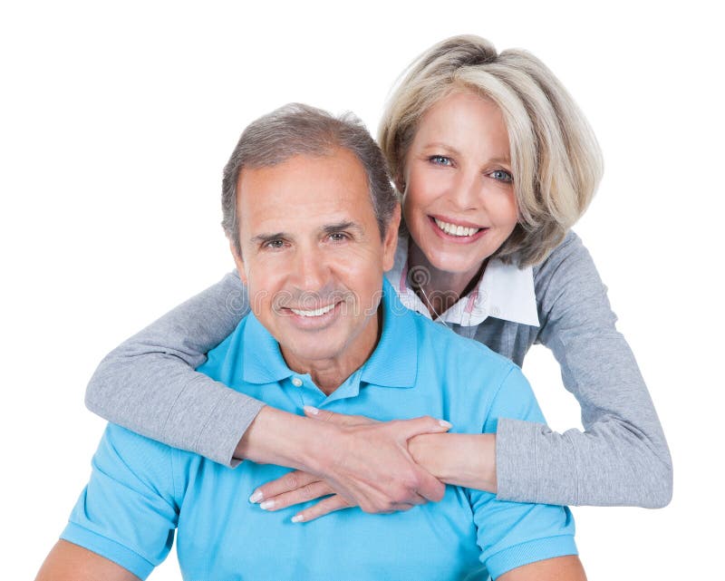 Woman Embracing Mature Man From Behind Sitting On Pilates Ball. Woman Embracing Mature Man From Behind Sitting On Pilates Ball