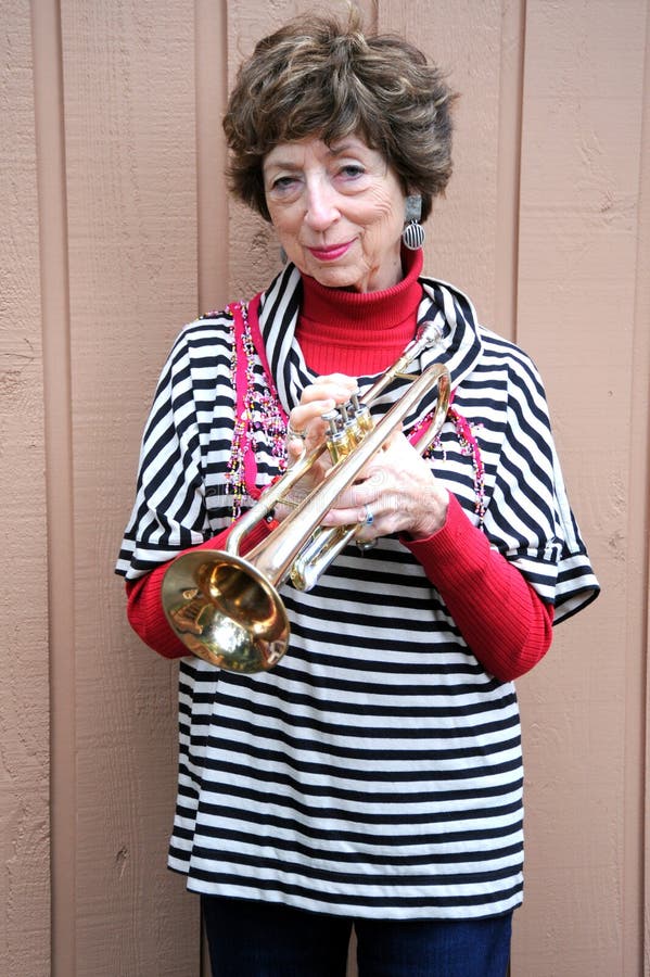 Mature female trumpet player.