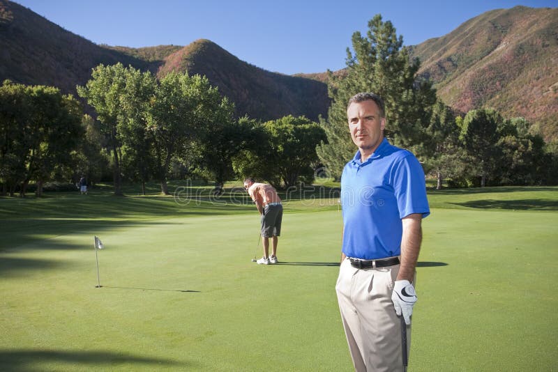 Mature Golfer on the course stock photo Mature Golfer on the course stock photo