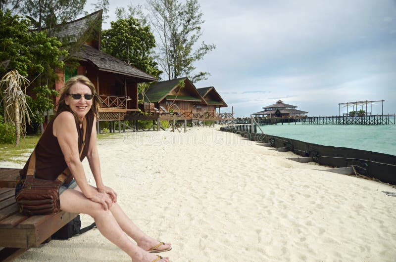 Mature happy smiling carefree woman holiday tropical island resort beach royalty free stock image Mature happy smiling carefree woman holiday tropical island resort beach royalty free stock image