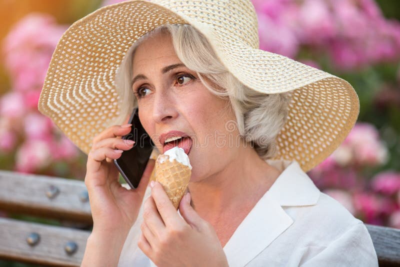 Mature lady with cell phone. royalty free stock photography Mature lady with cell phone. royalty free stock photography