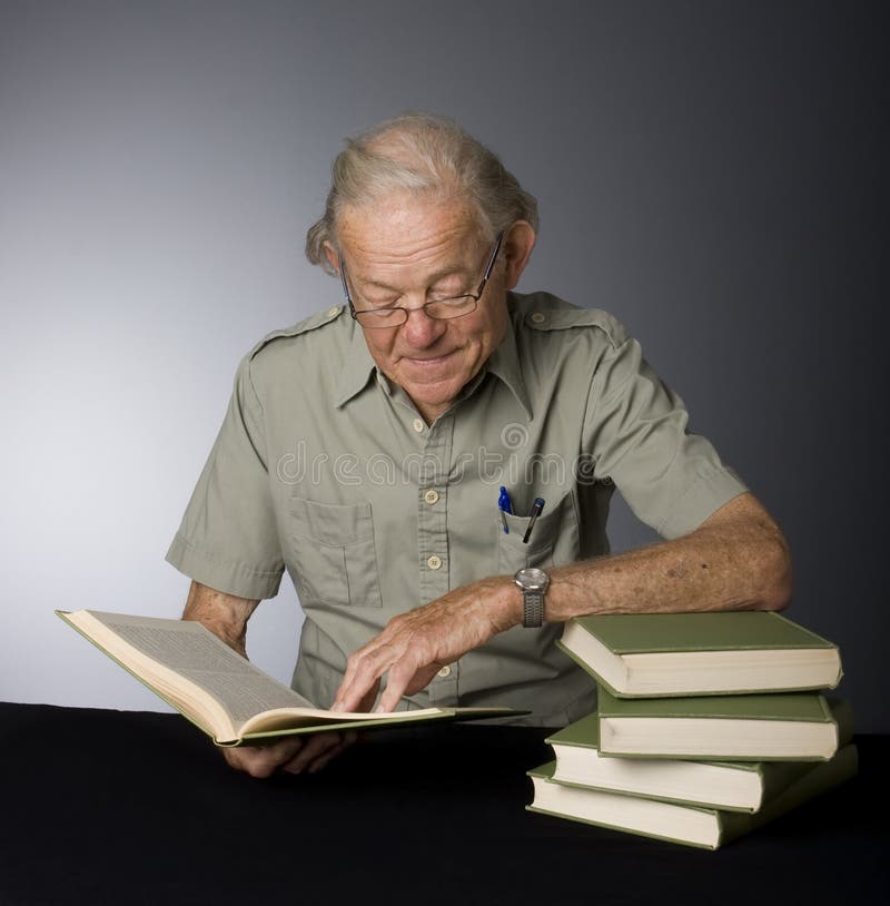 Mature Male Scholar stock image. Image of reading