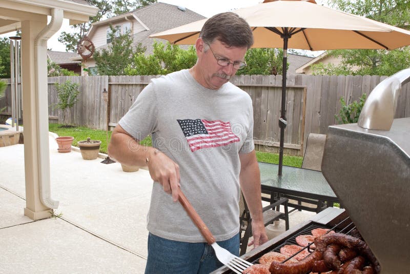 Mature man barbecuing